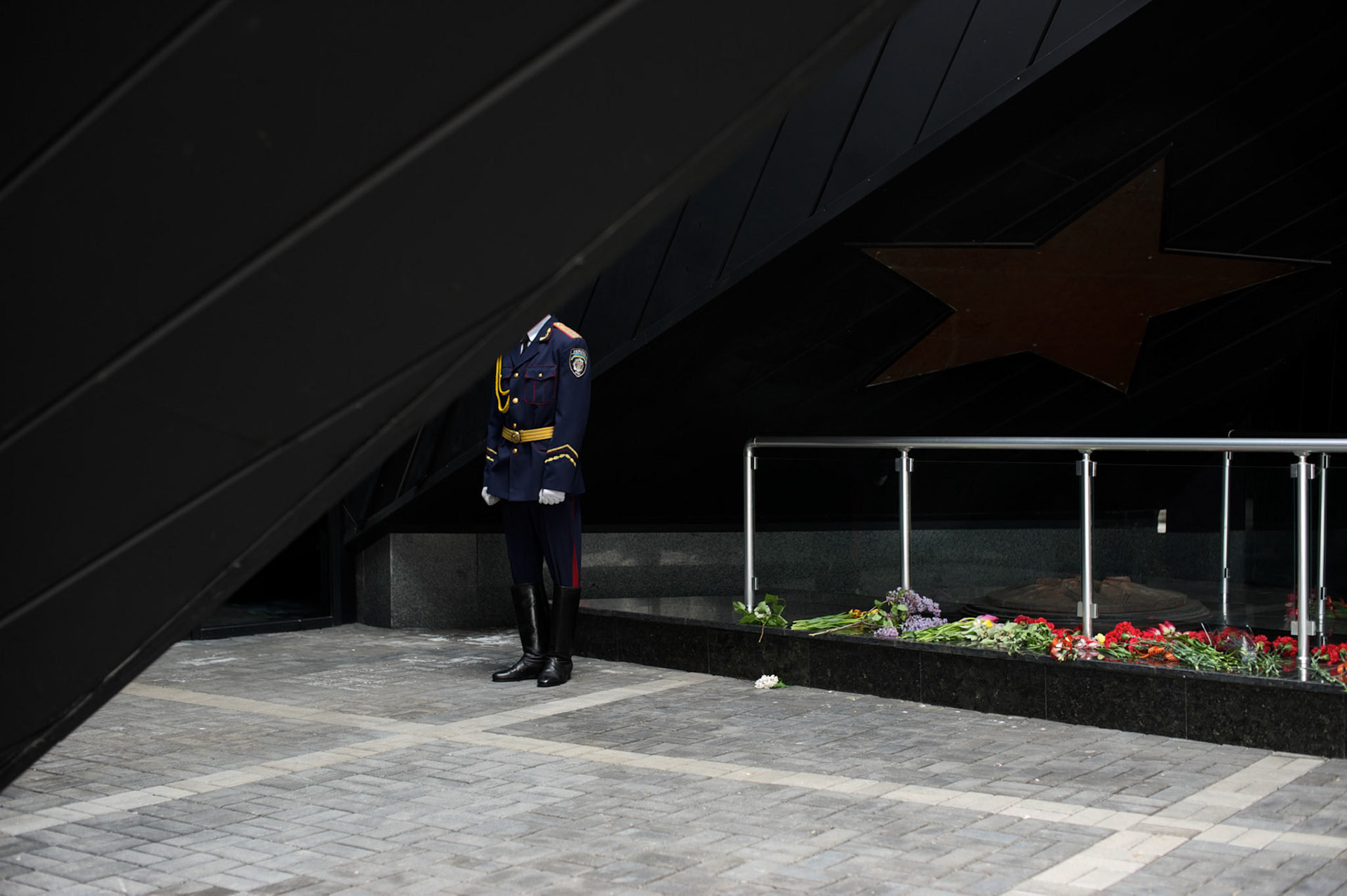 A Ukrainian policeman stands guard during V-Day commemorations in Donetsk.