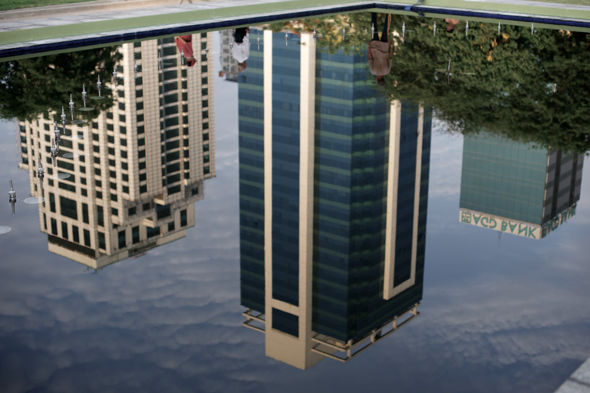 May 09, 2013 - Yangon, Myanmar: The reflexion of business buildings in a fountain at a public park in central Yangon. (Paulo Nunes dos Santos/Polaris)