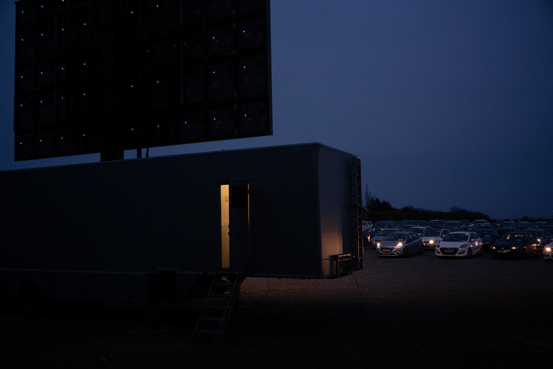 A single staff member operates the screening from a control room set up inside a trailer. With the sessions on hold due to new restrictions on social gatherings, most of the staff will be out of work for the time being. Dublin, Ireland - March 23, 2020.