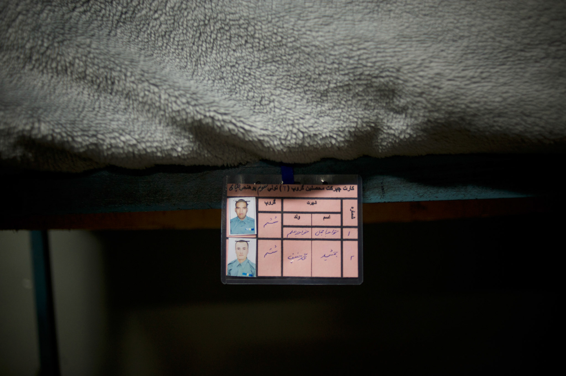 The ID card of a Afghan National Police (ANP) cadets marks their bunk in a dorm at the Afghan Nacional Police Academy in Kabul.