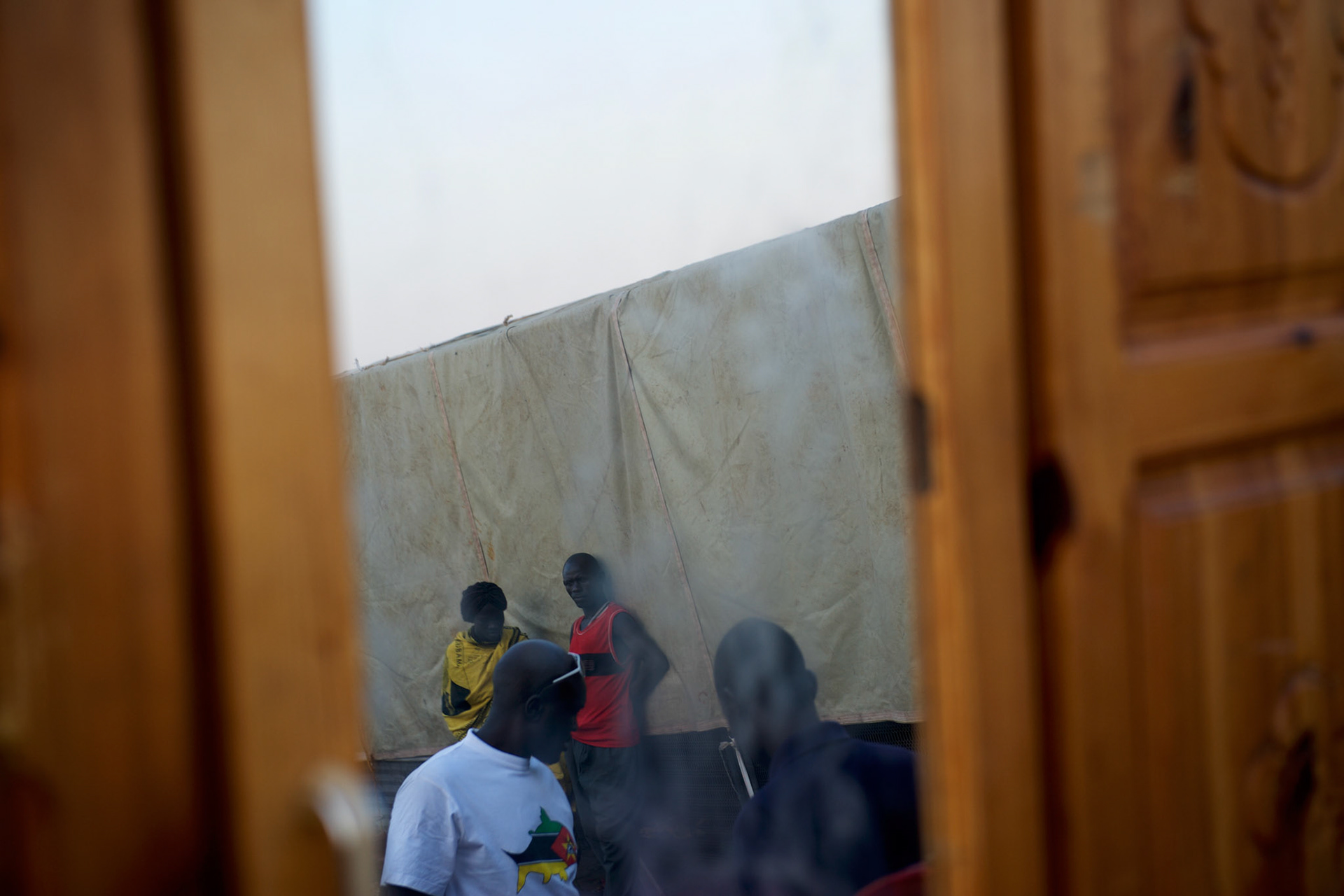 A group of South Sudanese, newly arrived from Khartoum, take guard of their belongings piled on the shores of the river Nile in Juba, as they await for international aid organisations to assist with their relocation somewhere in South Sudan.