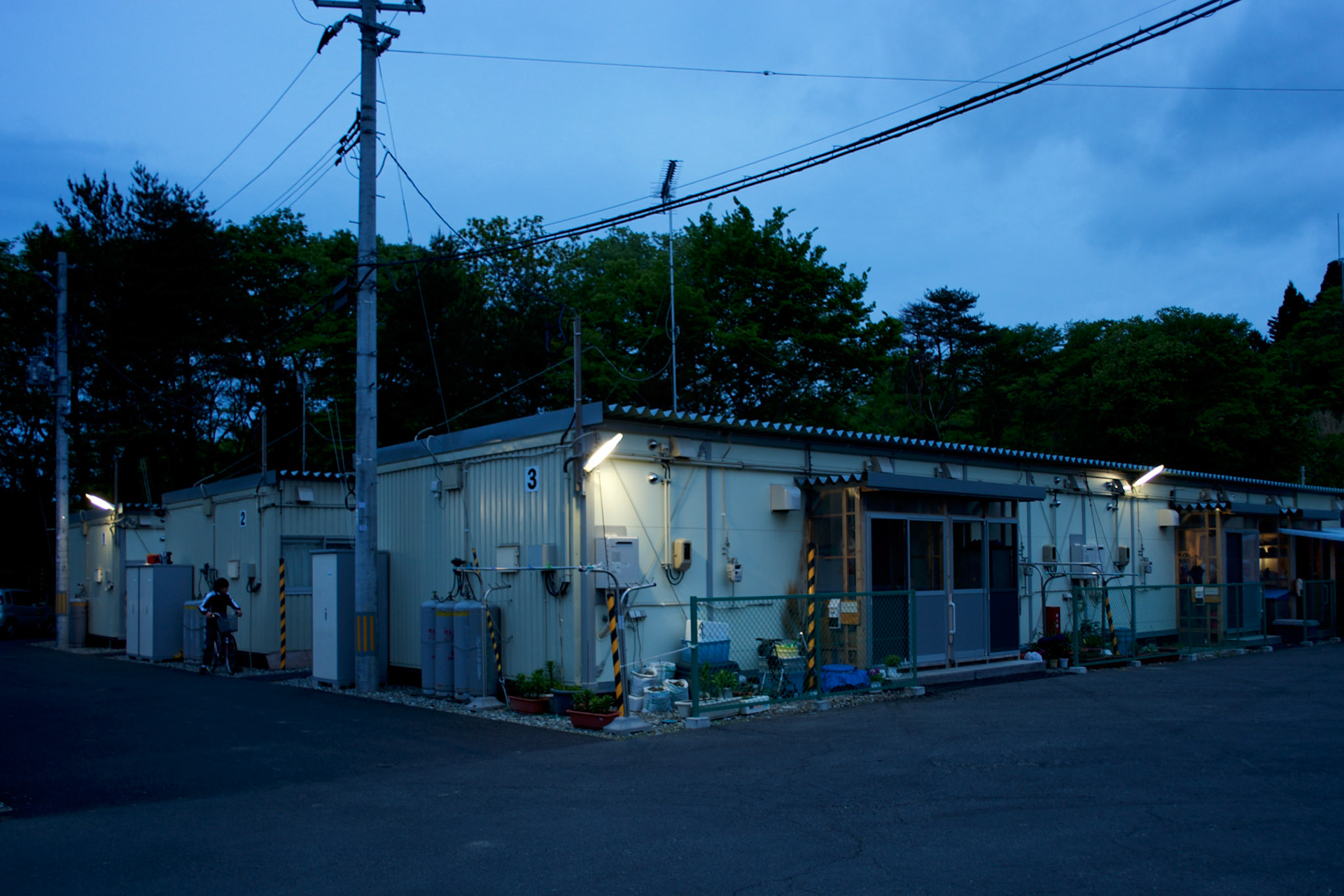 View of prefabricated houses used as temporary shelter for families who lost their homes during the devastating earthquake and tsunami that hit Togura, a fishing village in the east coast of Japan, in 2011. On the third anniversary of the disaster, nearly 270,000 remain displaced.