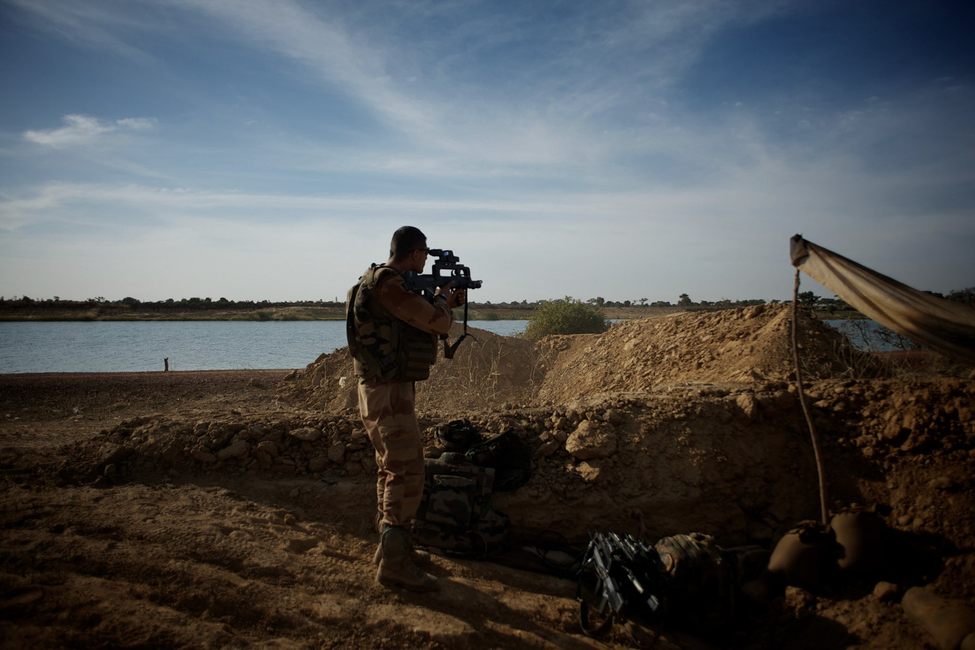 January 19, 2013 - Markala, Mali: French Army men take defensive position in the outskirts of Markala, in preparation for an advance towards the northern city of Diabaly, under siege by islamist militants since the 14th of January.Several insurgent groups have been fighting a campaign against the Malian government for independence or greater autonomy for northern Mali, an area known as Azawad. The National Movement for the Liberation of Azawad (MNLA), an organisation fighting to make Azawad an independent homeland for the Tuareg people, had taken control of the region by April 2012.The Malian government pledge to the French army to help the national troops to stop the rebellion advance towards the capital Bamako. The french troops started aerial attacks on rebel positions in the centre of the country and deployed several hundred special forces men to counter attack the advance on the ground. (Paulo Nunes dos Santos)