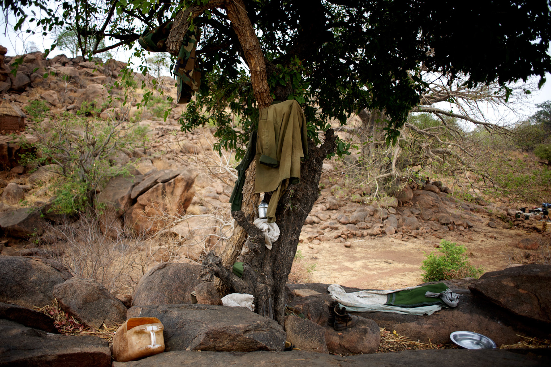Personal belongings of a Sudan People's Liberation Movement (SPLA-N) rebel fighter, are seen near a tree in Jebel Kwo military base near Tess village in the rebel-held territory of the Nuba Mountains in South Kordofan.