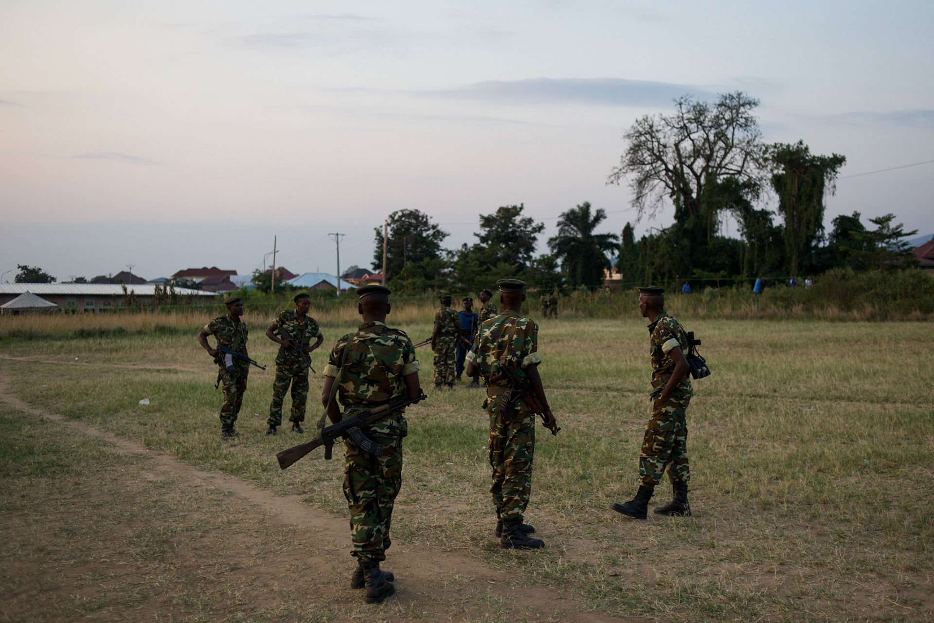 Burundian military men take guard of take guard at a field in Musaga neighbourhood, in Bujumbura, where tents have been settled to be used as a polling station for the upcoming parliamentary elections, June 28th, 2015.