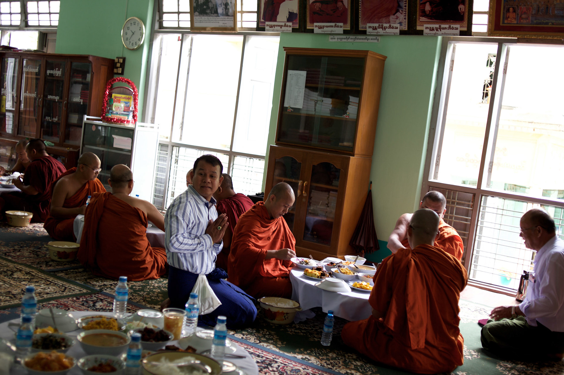 May 14, 2013 - Mandalay, Myanmar: Ashin Wirathu (centre), the spiritual leader of Burma's Buddhist Nationalist anti-Muslim movement 969 group, takes a midday meal offered by regular citizens at Mosayein Monastery in central Mandalay. Wirathu, who was jailed in 2003 for inciting religious hatred, refers to himself as "the Burmese Bin Laden". CREDIT: Paulo Nunes dos Santos