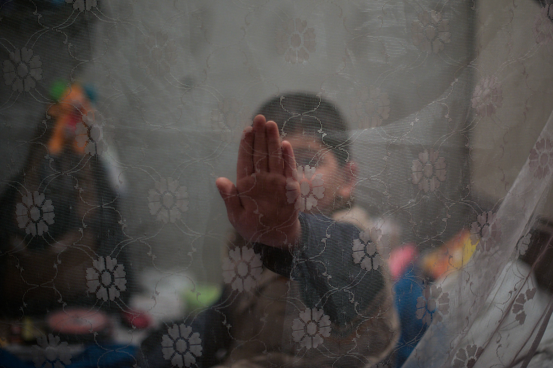 A child in a temporary room of a bomb shelter outside Donetsk.