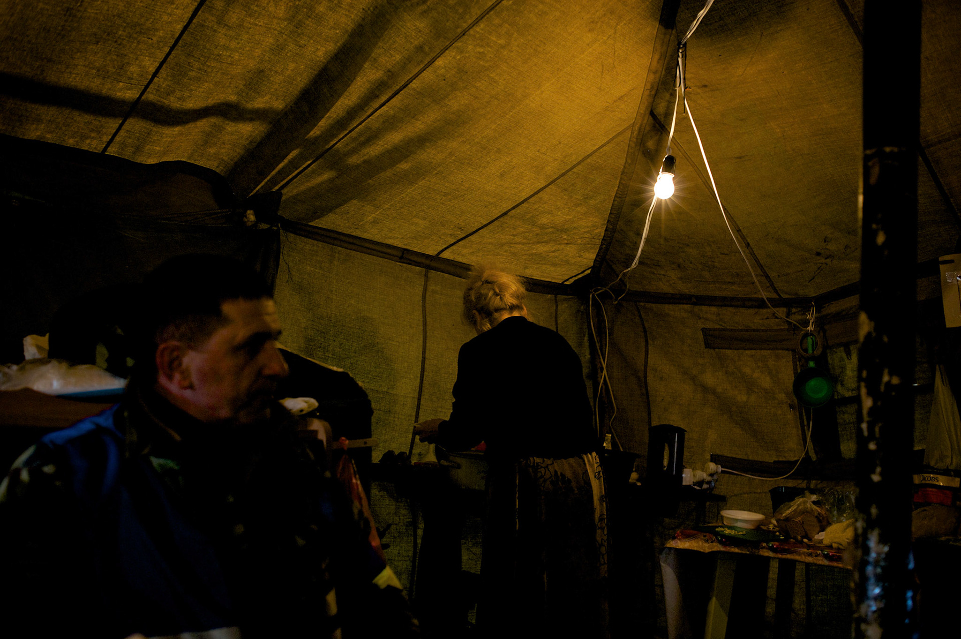 Meals are served inside a tent housing a Ukrainian self-defence group near the Crimean border in Kherson.
