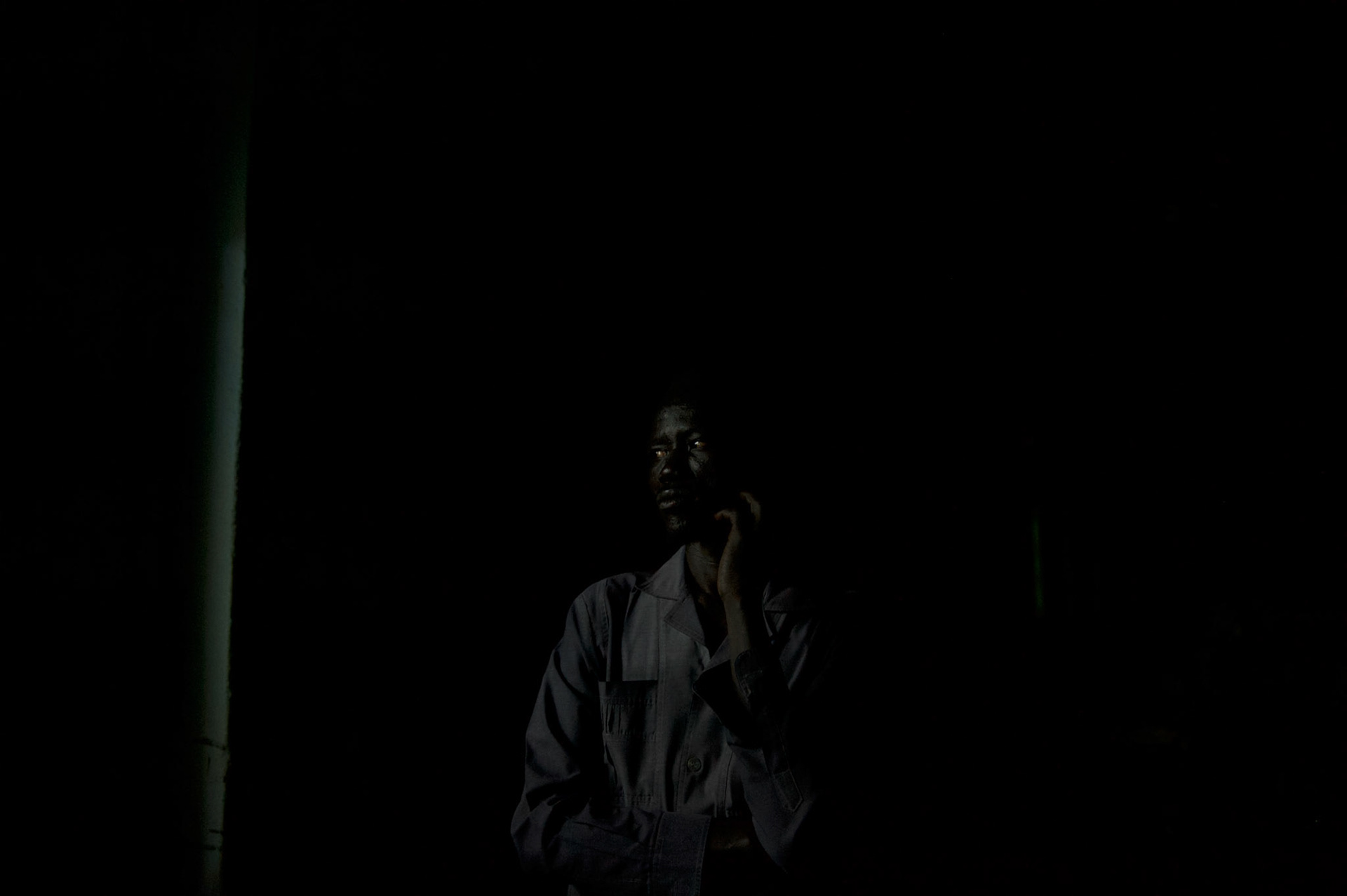 An elections monitor from the African Union, watches the counting of the votes of the referendum for independence of South Sudan, at a polling station in central Juba.