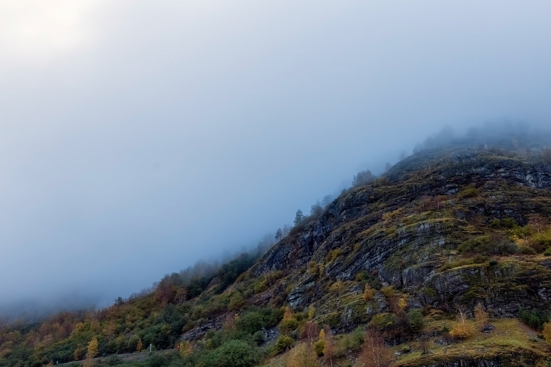 Cloud enveloped hills around Flåm, in early morning light