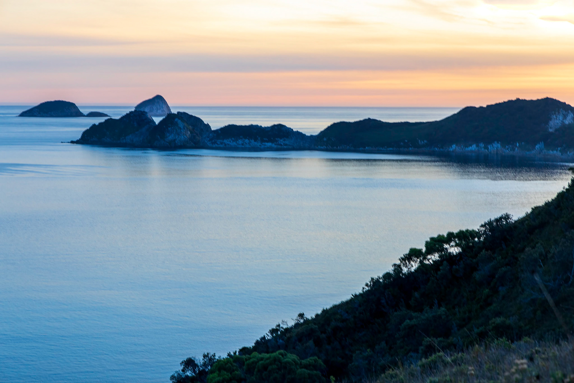 Breaksea Islands, silhouetted at sunset