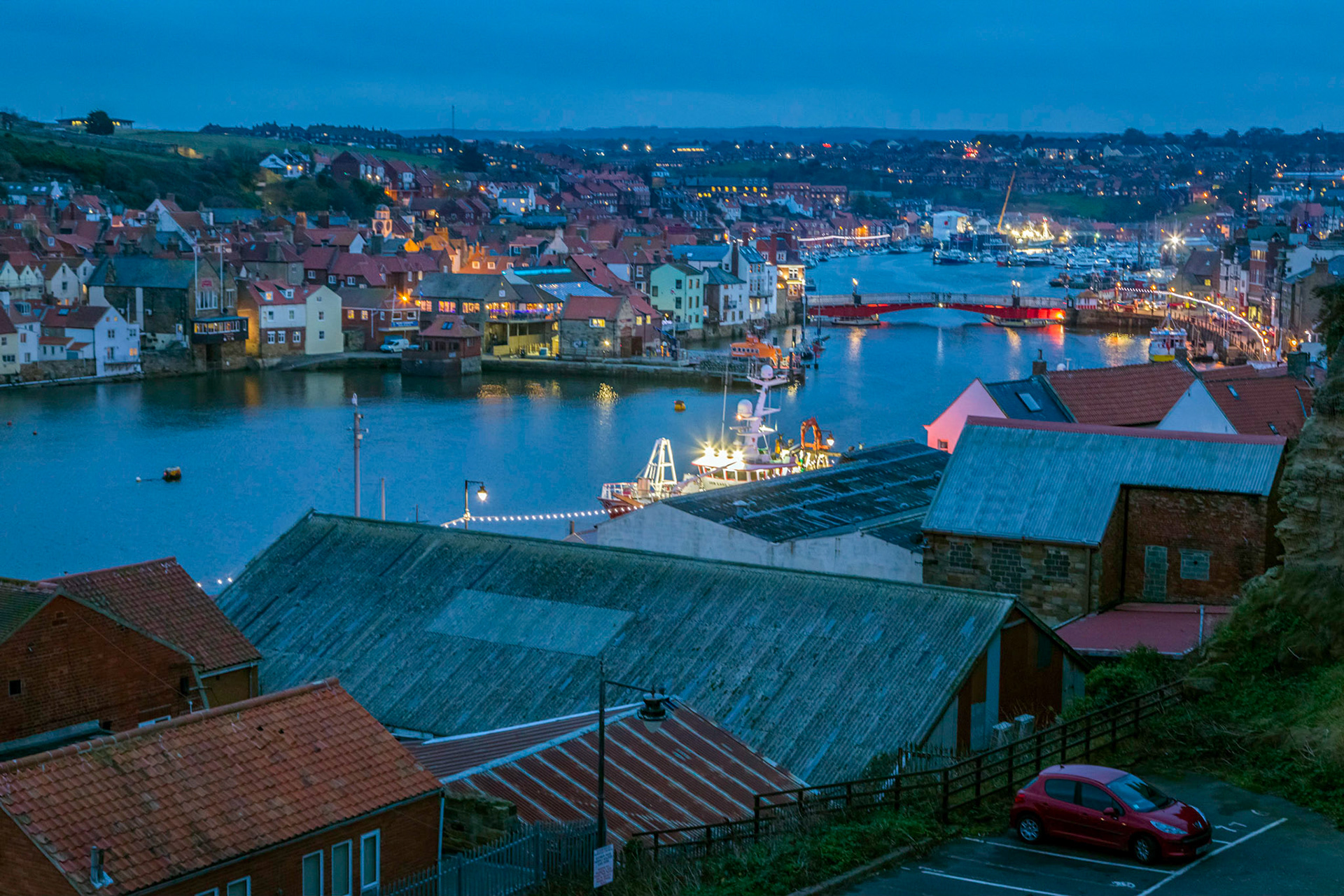 Early evening in Whitby harbour at the mouth of the River Esk