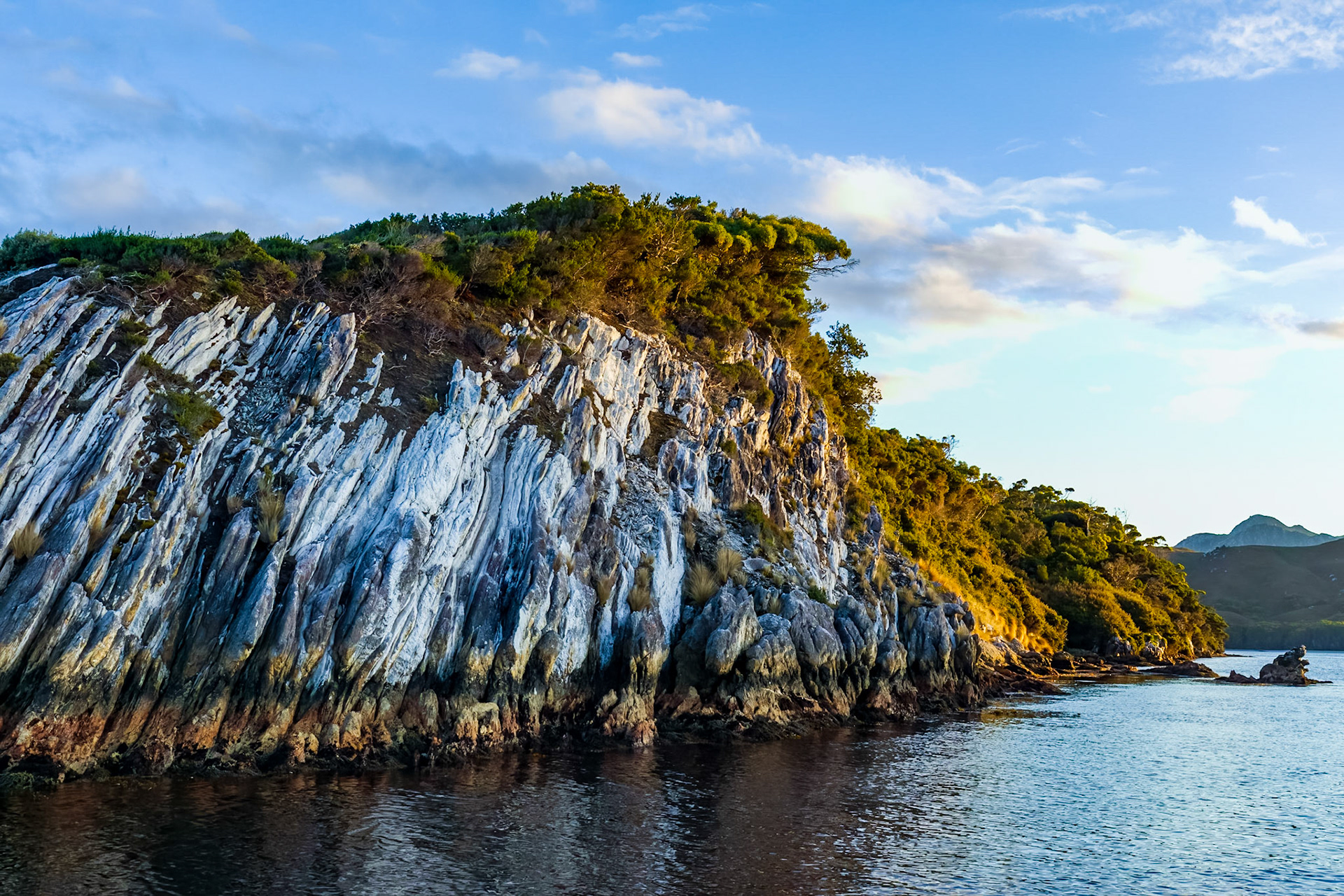 Illumination by the first rays of sunlight coming over the ranges.