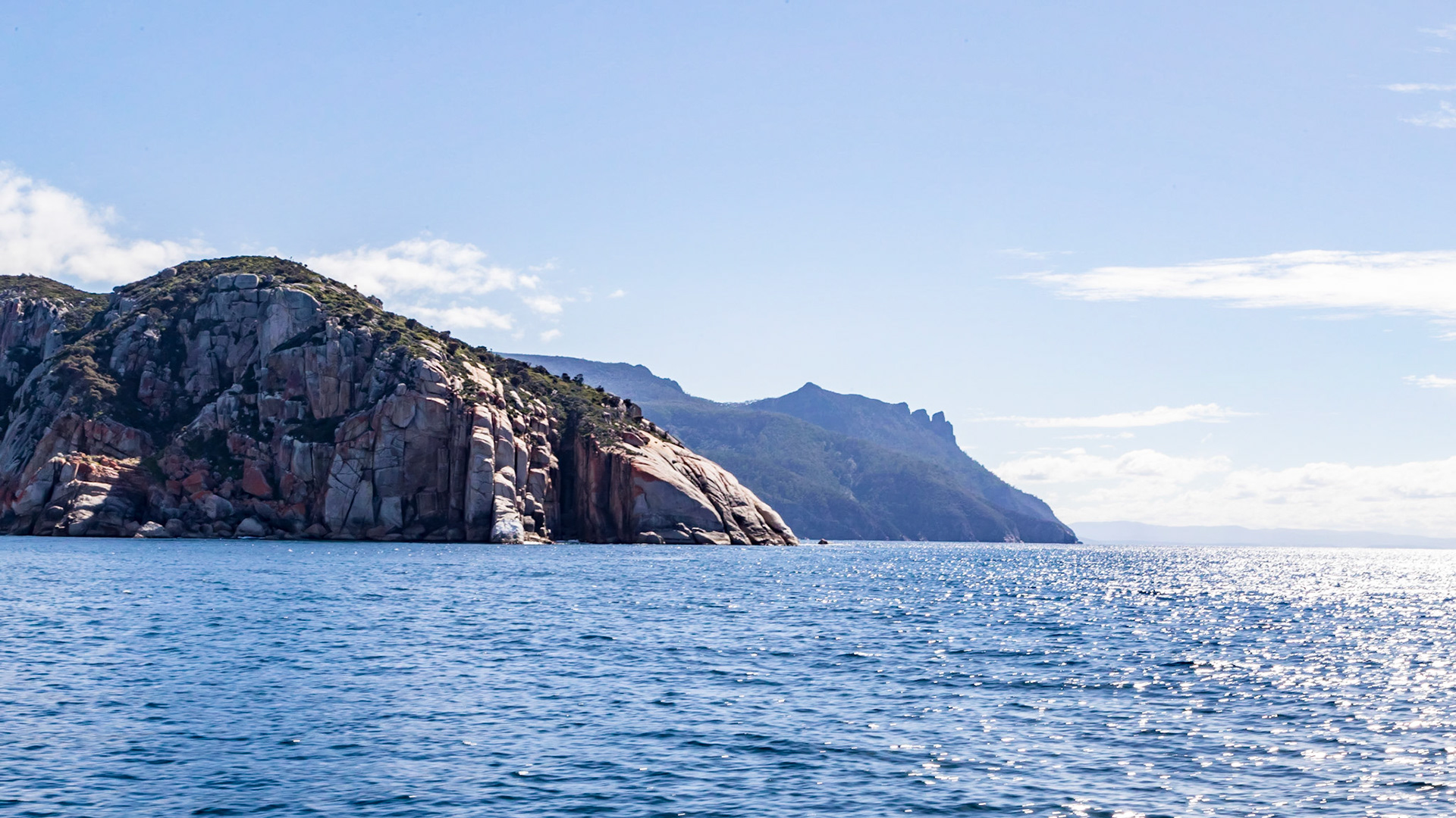 Around Mistaken Cape, with the view north to the Bishop and Clerk peaks.. Maria Island