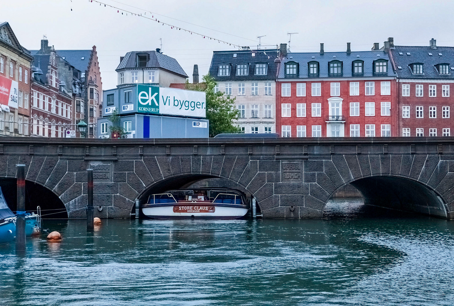 Tight fit for the river boat to pass under the bridge