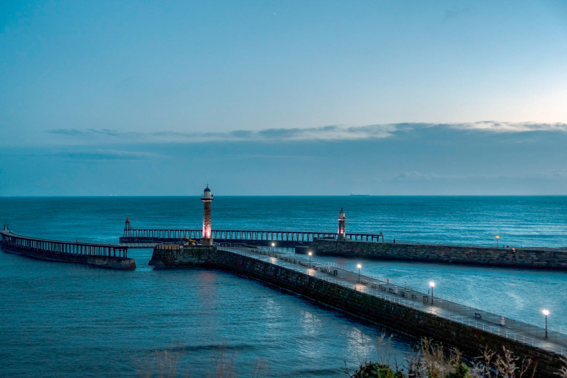 Late evening at the harbour entrance, at the mouth of the River Esk at Whitby.