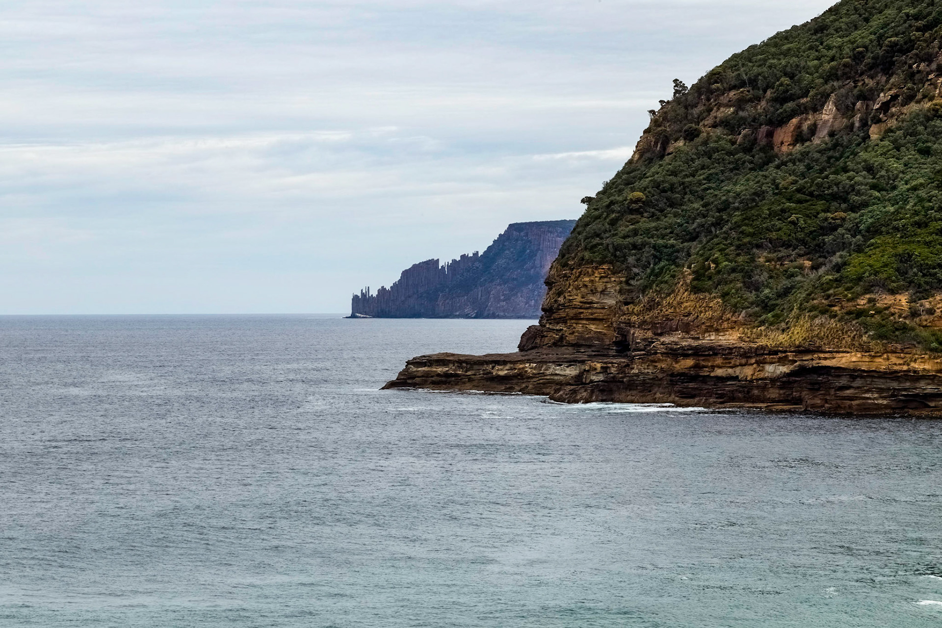 Distant Cape Raoul across Maingon Bay