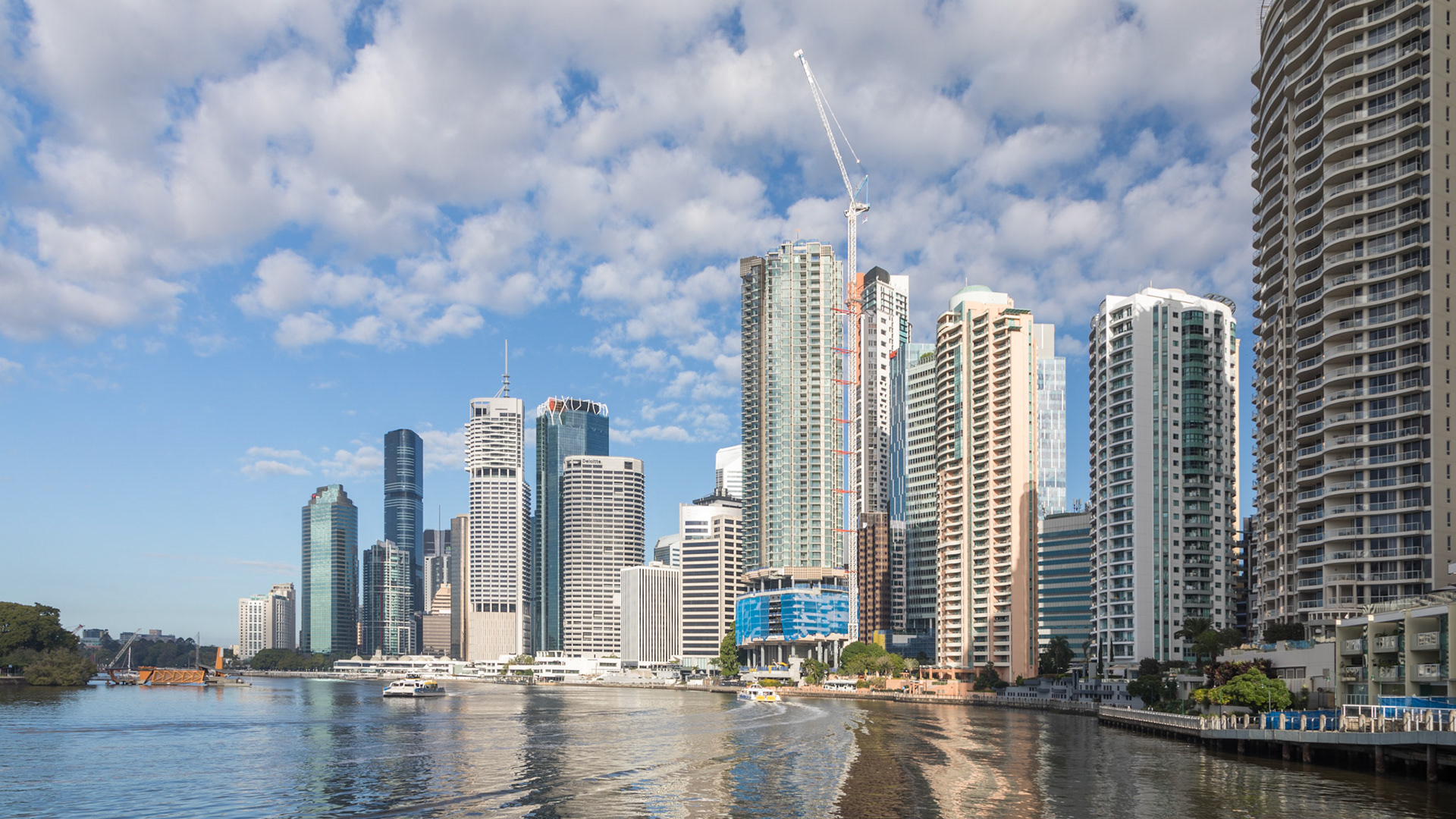 Fron beneath the bridge, towards Eagle Pier, city buildings and botanic gardens.