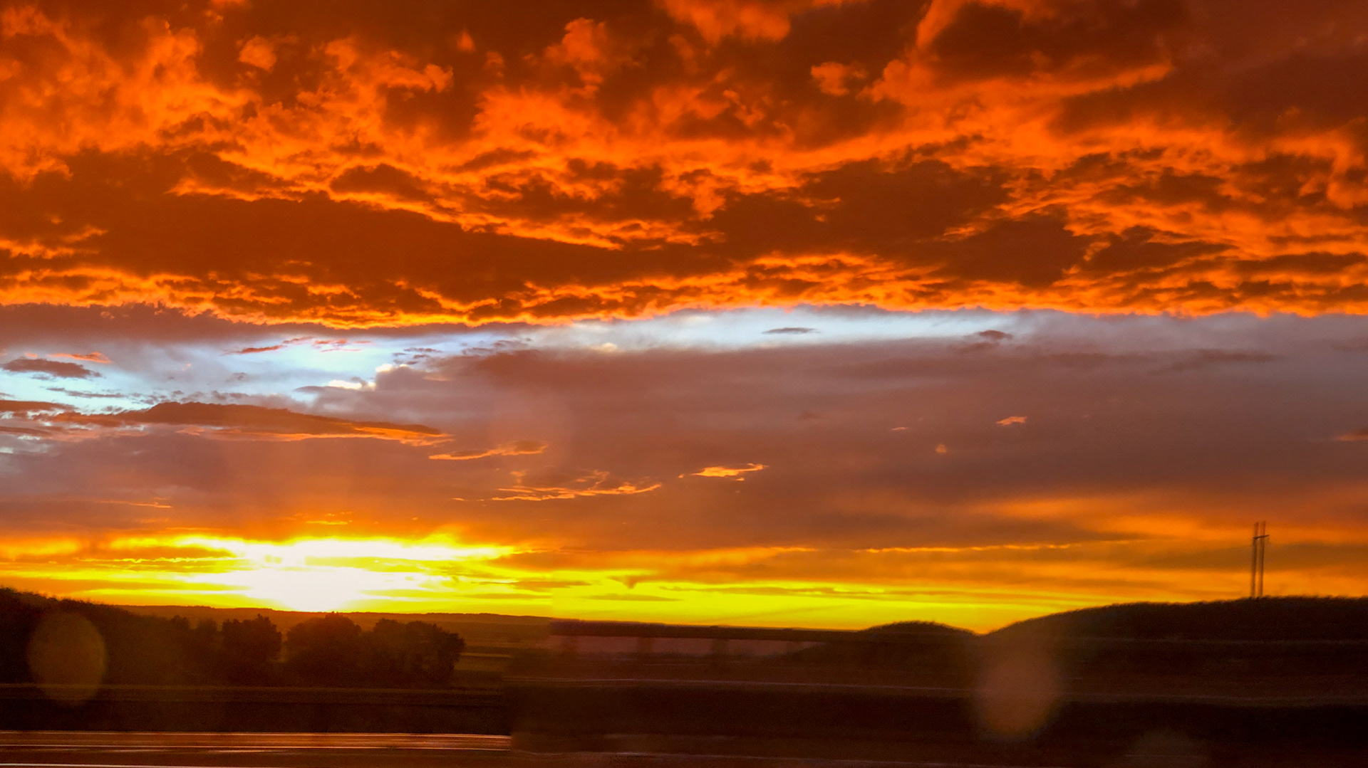 14 Jul: Watching the sun set as we travel through Montana on I-95