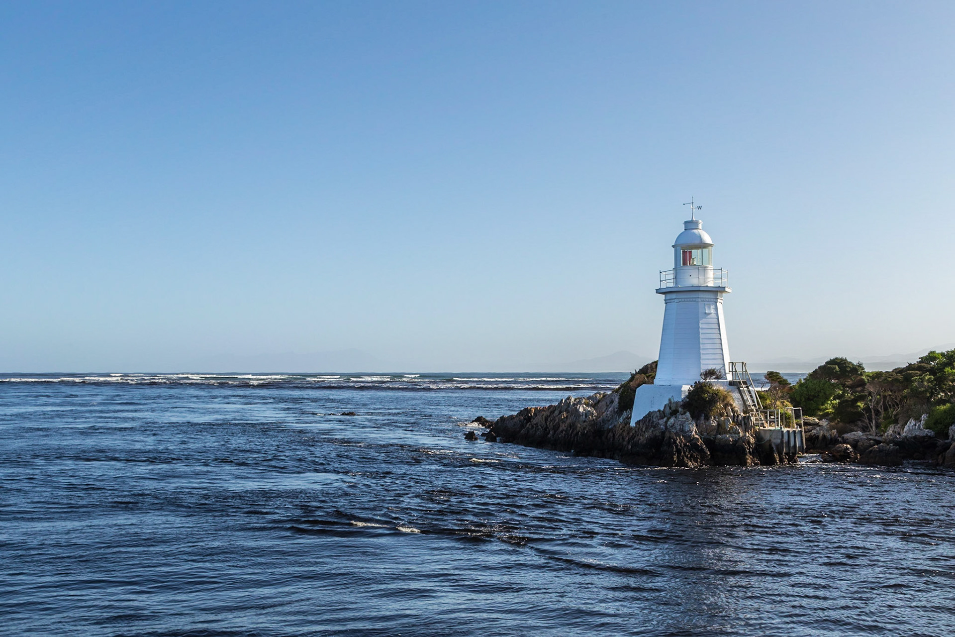 Hells Gates lighthouse. Narrow entrance to Macquarie Harbour