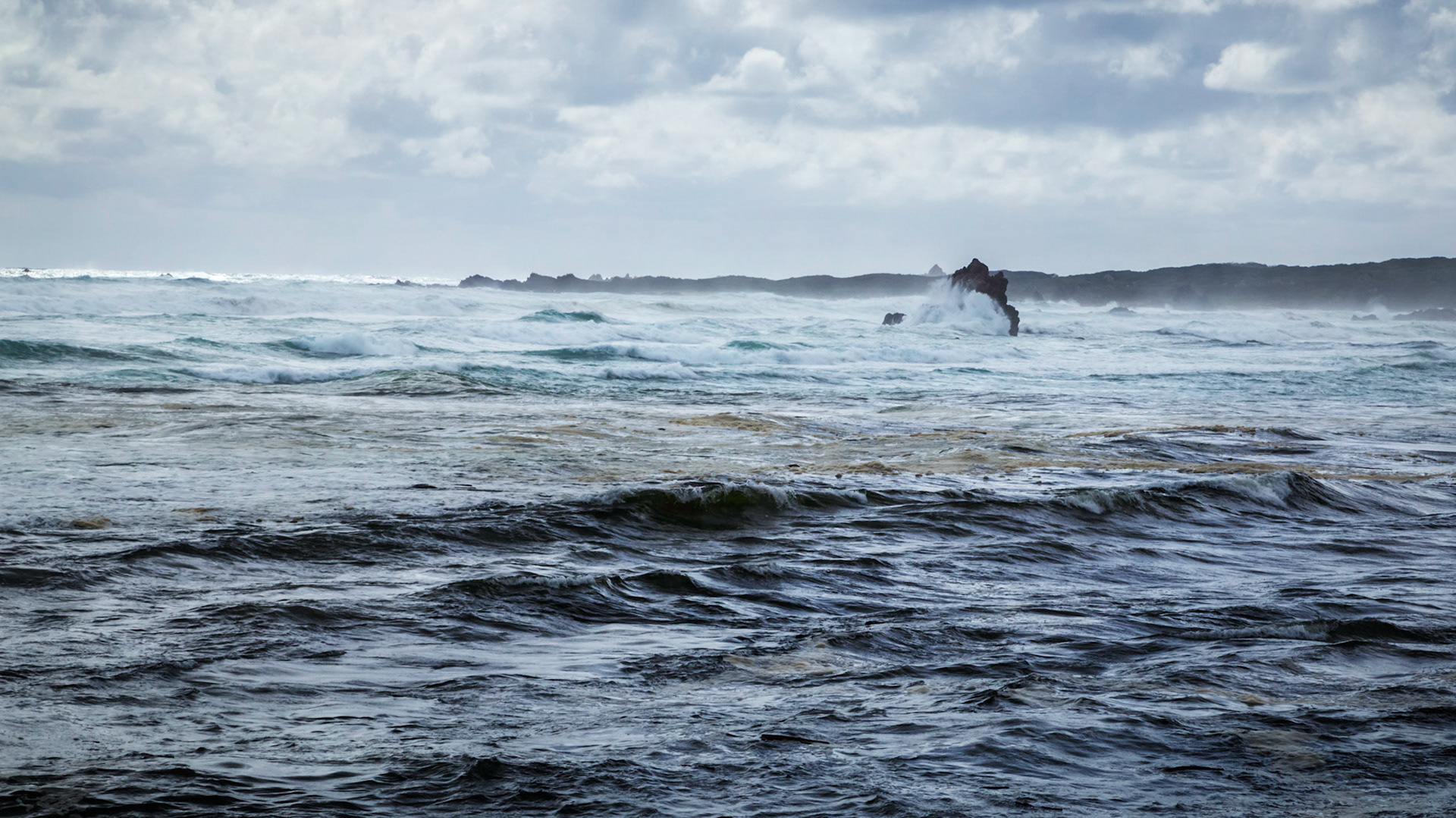 Waves pounding on to rocks at The Edge of the Earth.