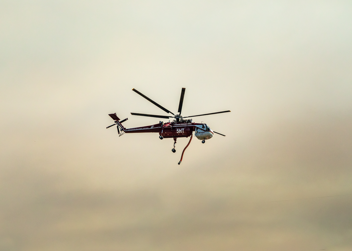 Water-bomber helicopter coming in to refill at a reservoir in the city of Flagstaff.