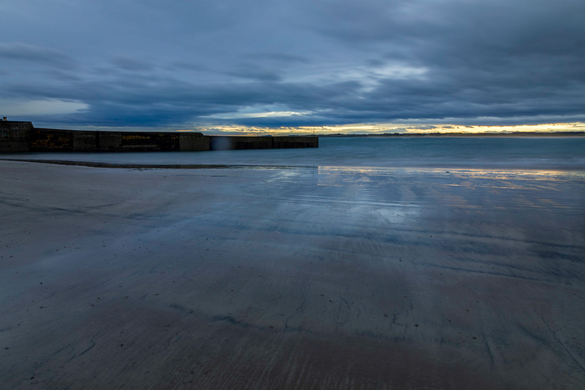 Beadnell Bay Beach and harbour breakwater walls