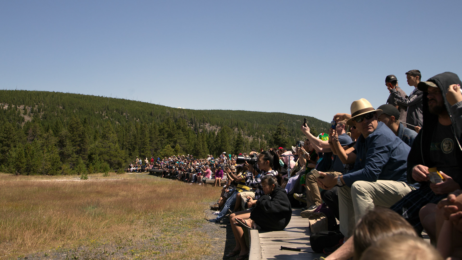 To my right, waiting for 'Old Faithful' Geyser. Legendary geyser erupting on schedule..