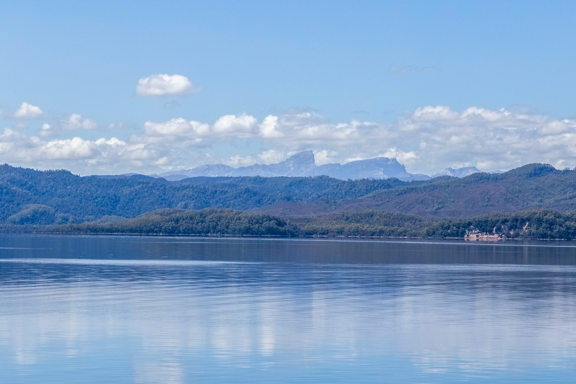 Distant Frenchmans Cap, seen from Macquarie Harbour
