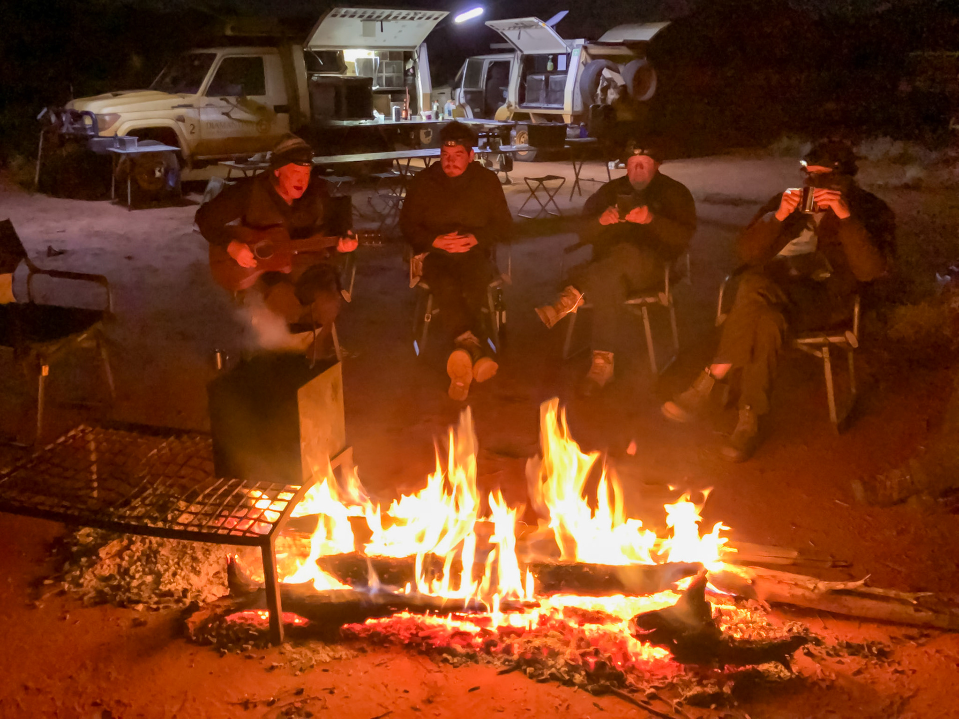 Andrew sings by the campfire