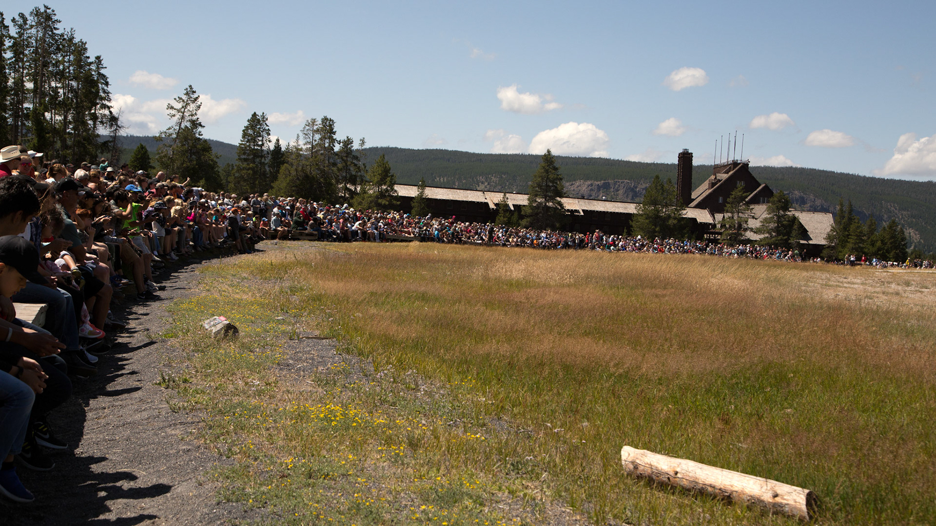 To my left, waiting for 'Old Faithful' Geyser. Legendary geyser erupting on schedule. 
