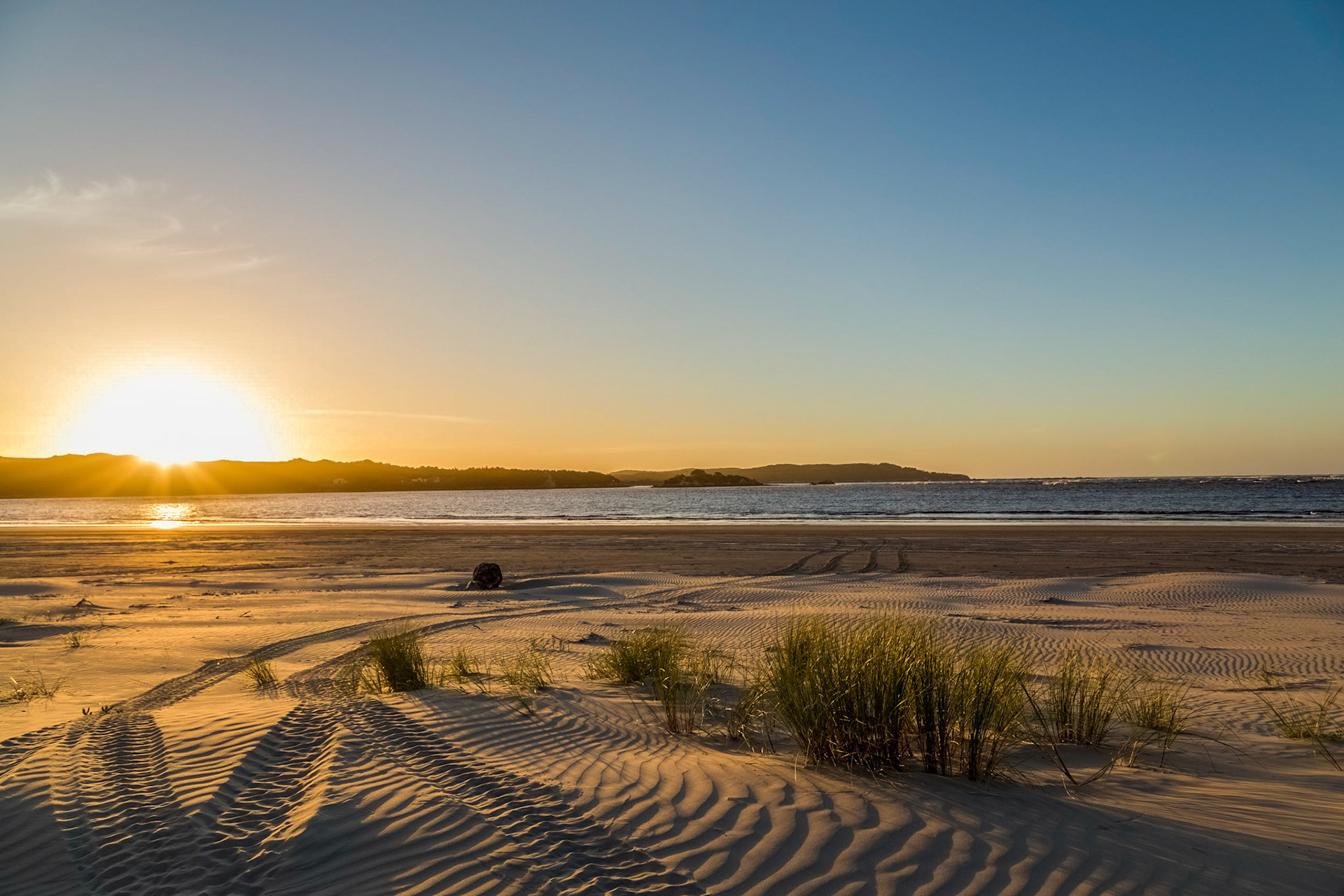 Watching from the beach the sun set over Macquarie Heads. With Strahan ATV Adventures