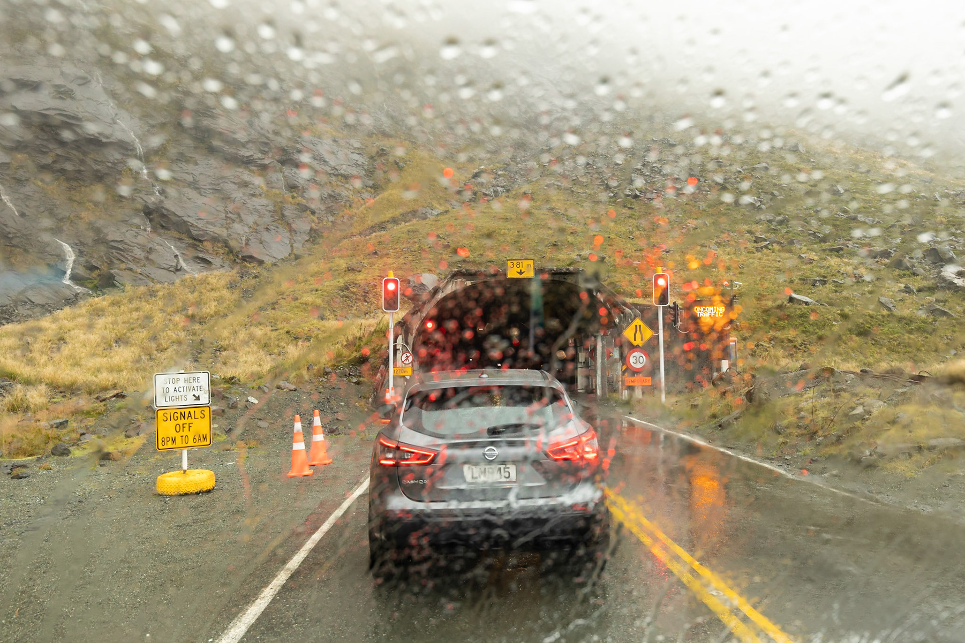 Raining; waiting to enter the Homer Tunnel on the way to Milford Sound