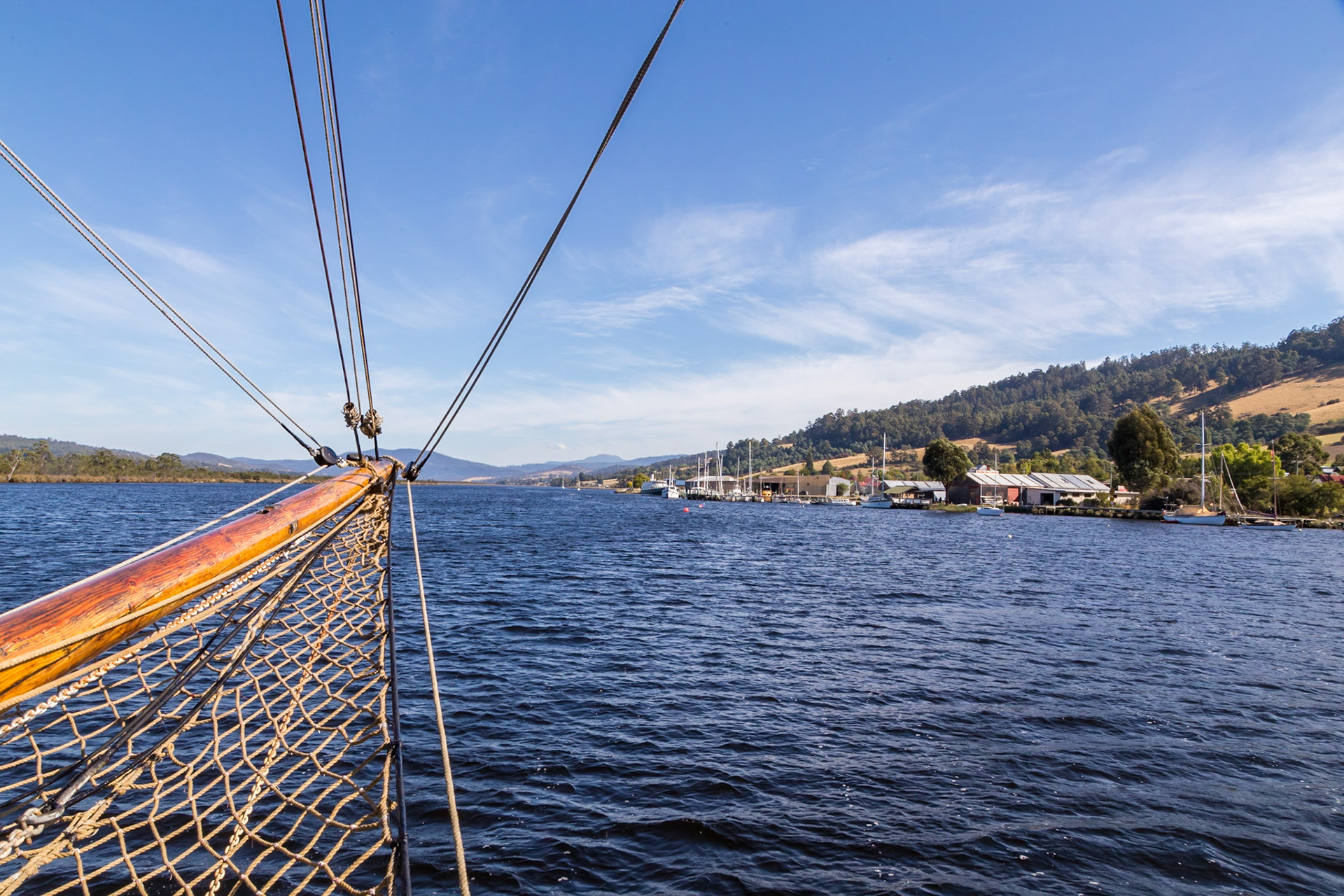 On the Ketch 'Yukon' sailing on the Huon River downriver with the town of Franklin off the starboard side