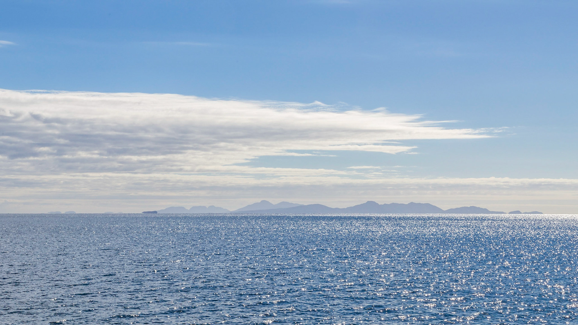 Distant Silhouette of the Freycinet Peninsula and Schouten Island, and closer Ile des Phoques. From the northern end of Maria Island