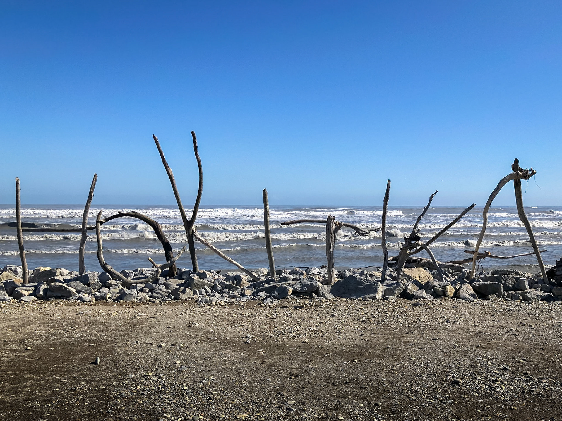 Driftwood Writing along the beach at Hokitika