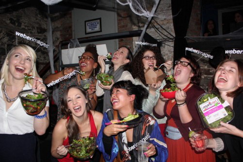 Women Laughing Alone While Eating Salad