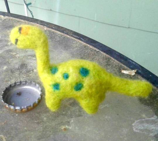 Miniature needle felted dinosaur