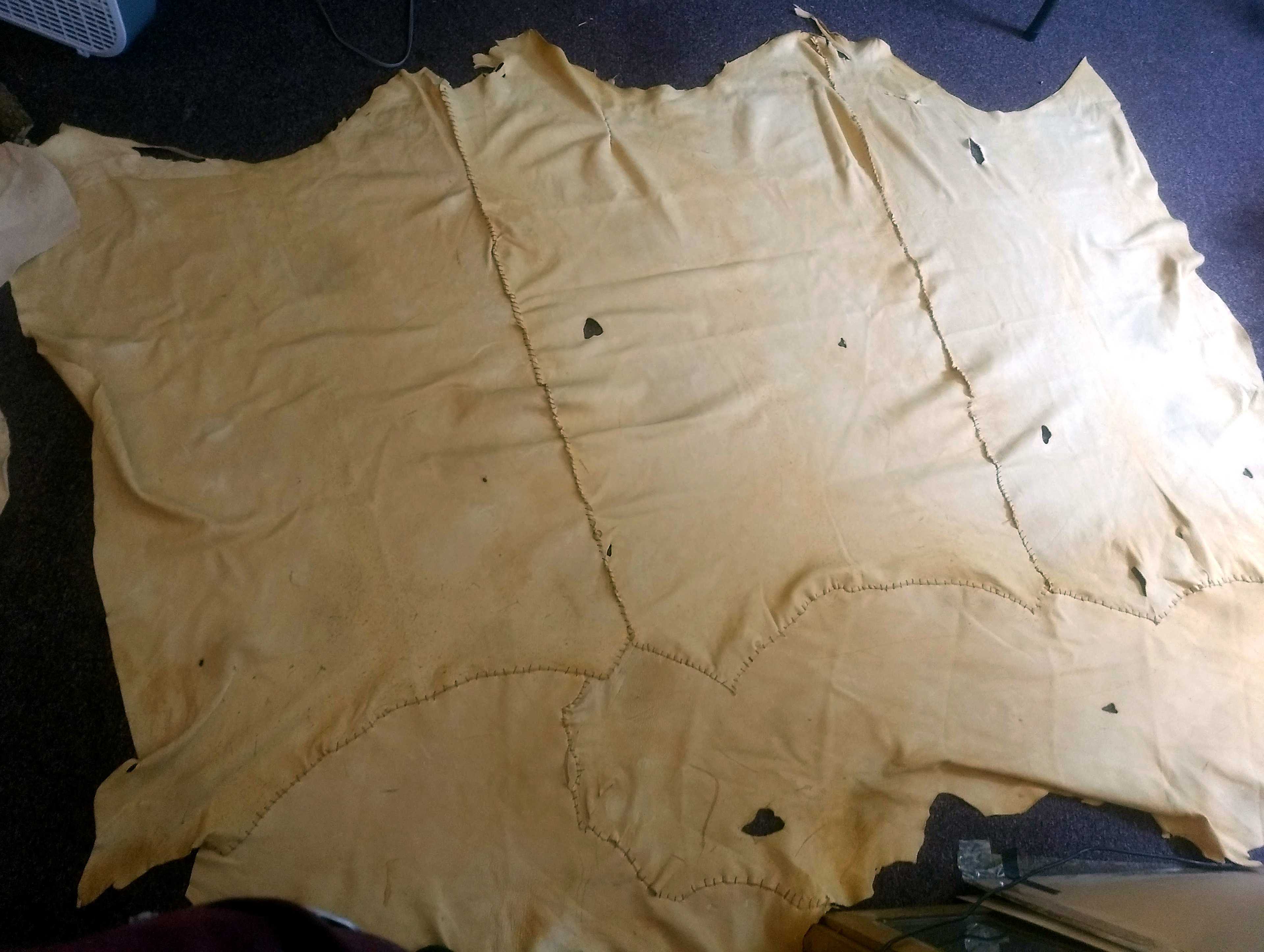 Hand-stitched buckskin curtains