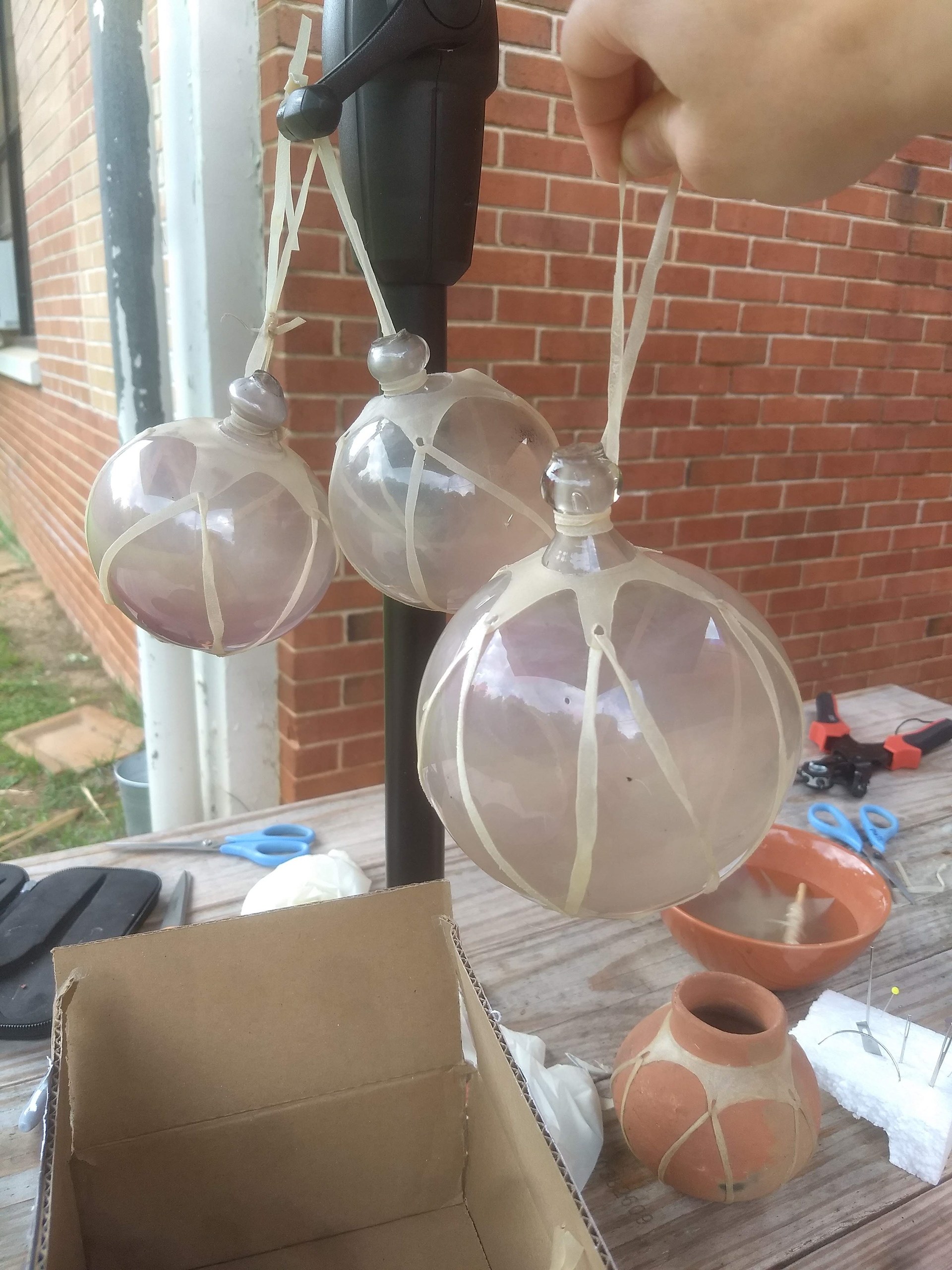 Hand cut & stretched goatskin hangers on antique globes