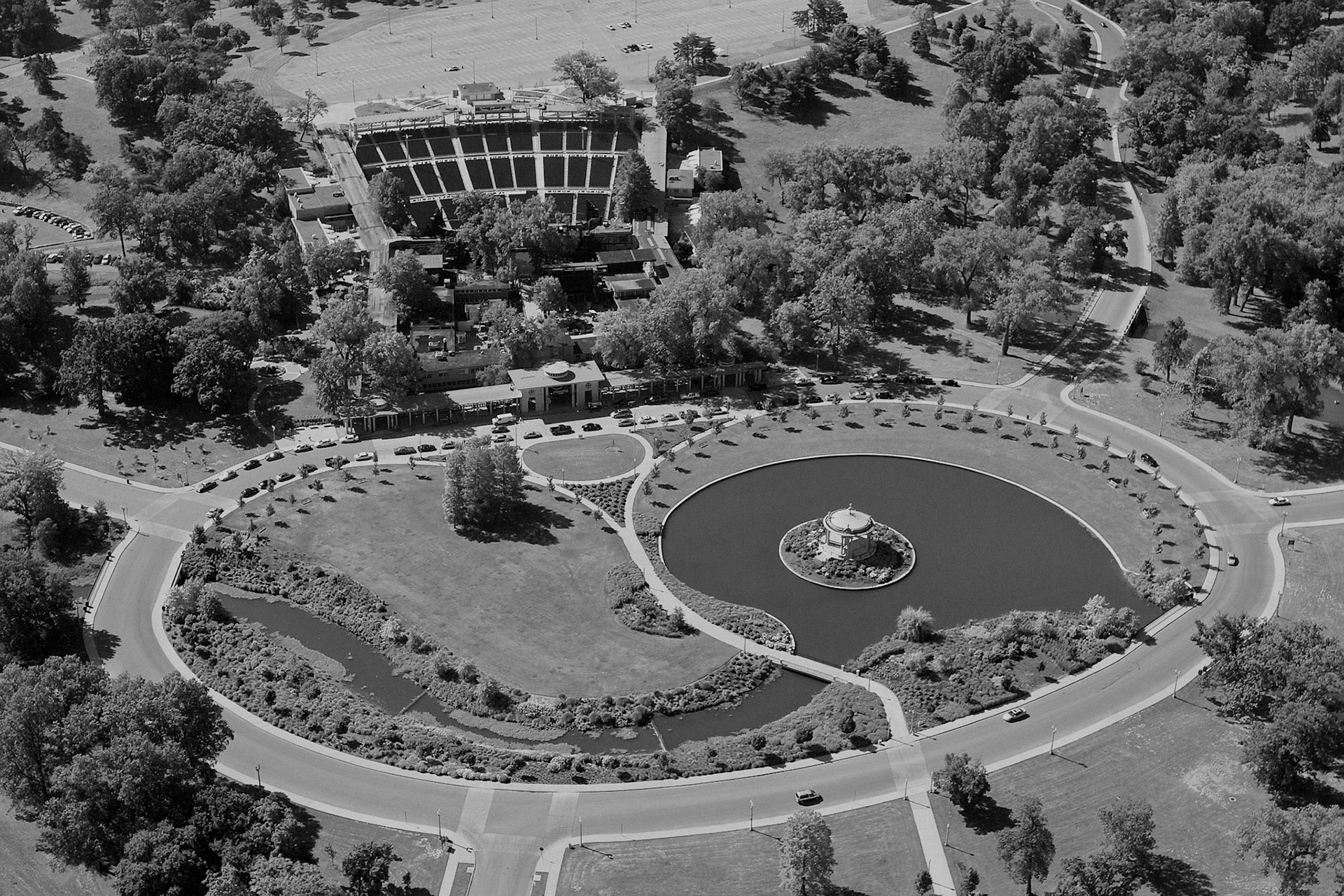 An aerial view from a helicopter of the Muny Opera area of Forest Park in St. Louis  In the center of the photo is the Pagoda Circle, often called the “heart of the park”, which surrounds the Nathan Frank Bandstand and serves as the grand entrance for The Muny.  The stadium seating, stage area and entrance for the Muny's theatrical performances are directly behind the circle.  Sometimes the pagoda is called the Muny Pagoda.