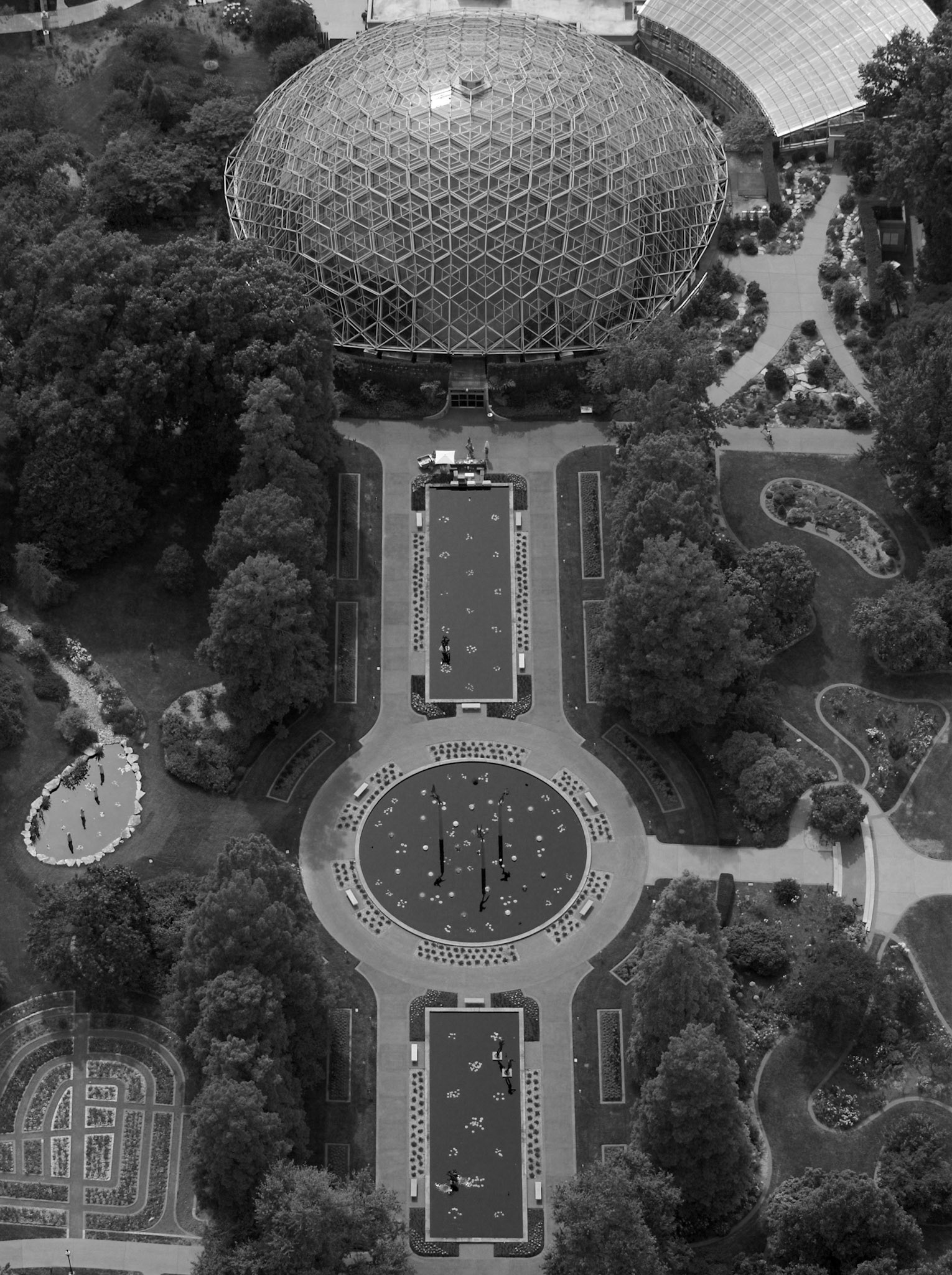 An aerial view of the Climatron and reflecting pools at the Missouri Botanical Garden in St. Louis, Missouri.  The reflecting pools are part of the Milles Sculpture garden and have floating Chilhuly glass sculptures.