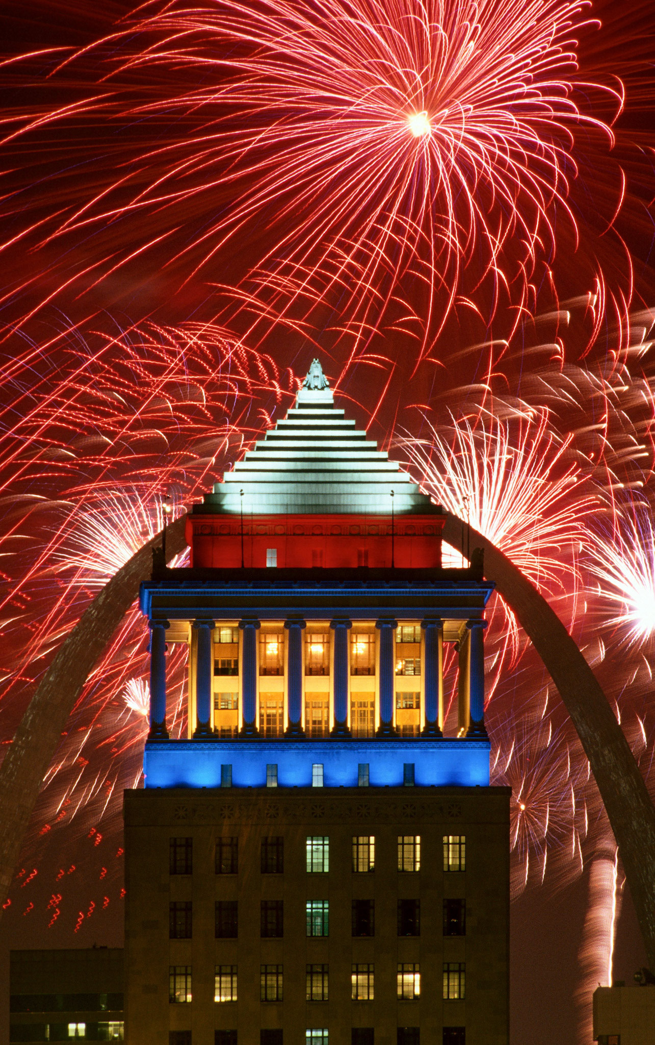 Fireworks over the Civil Courts building and Gateway Arch on July 4, 2000 in St. Louis, Missouri.