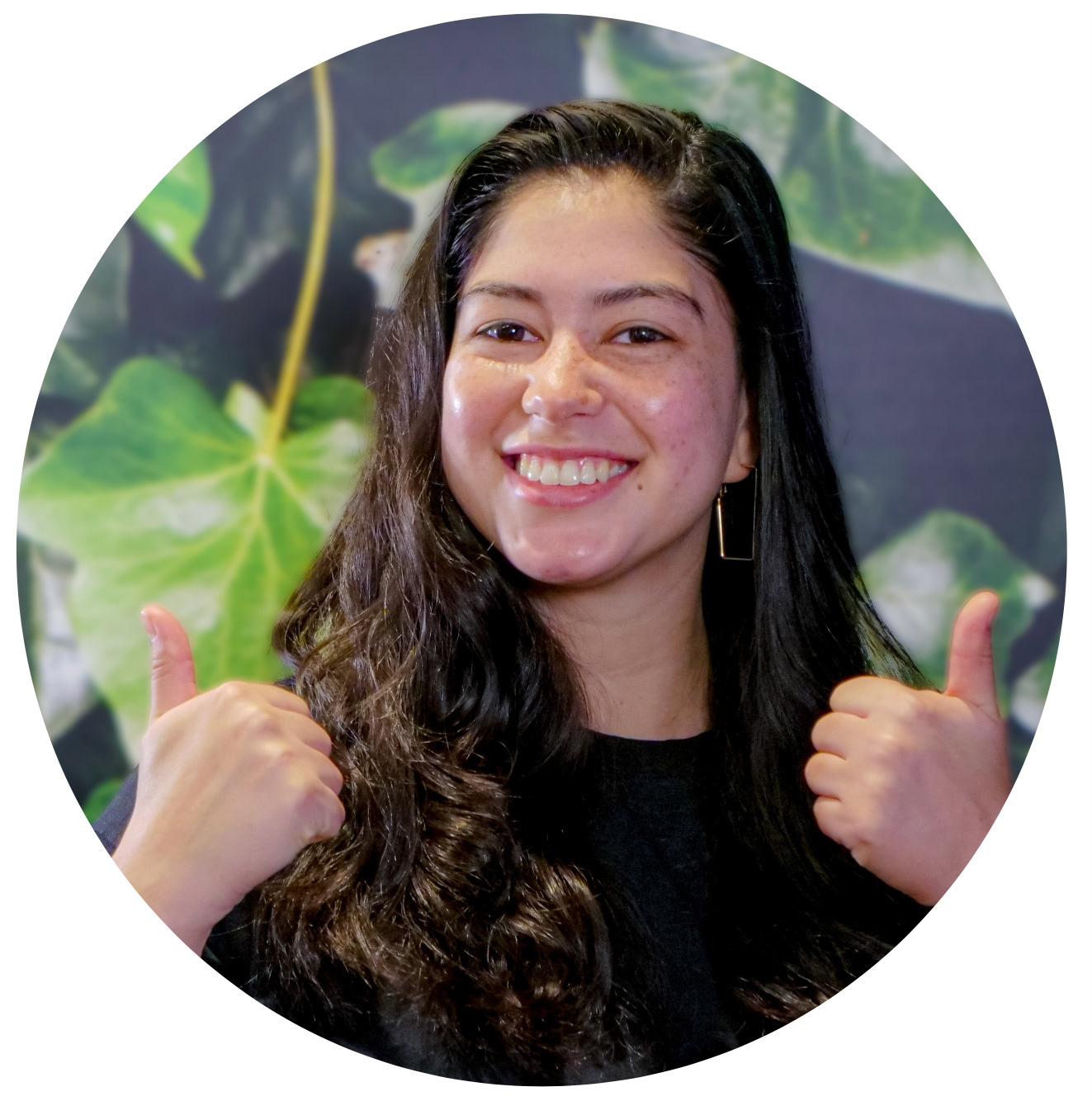 Stephanie is smiling and has two thumbs up