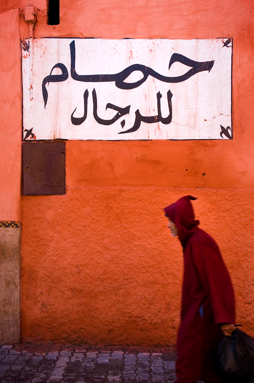 Old man walking in the streets of Marrakech.