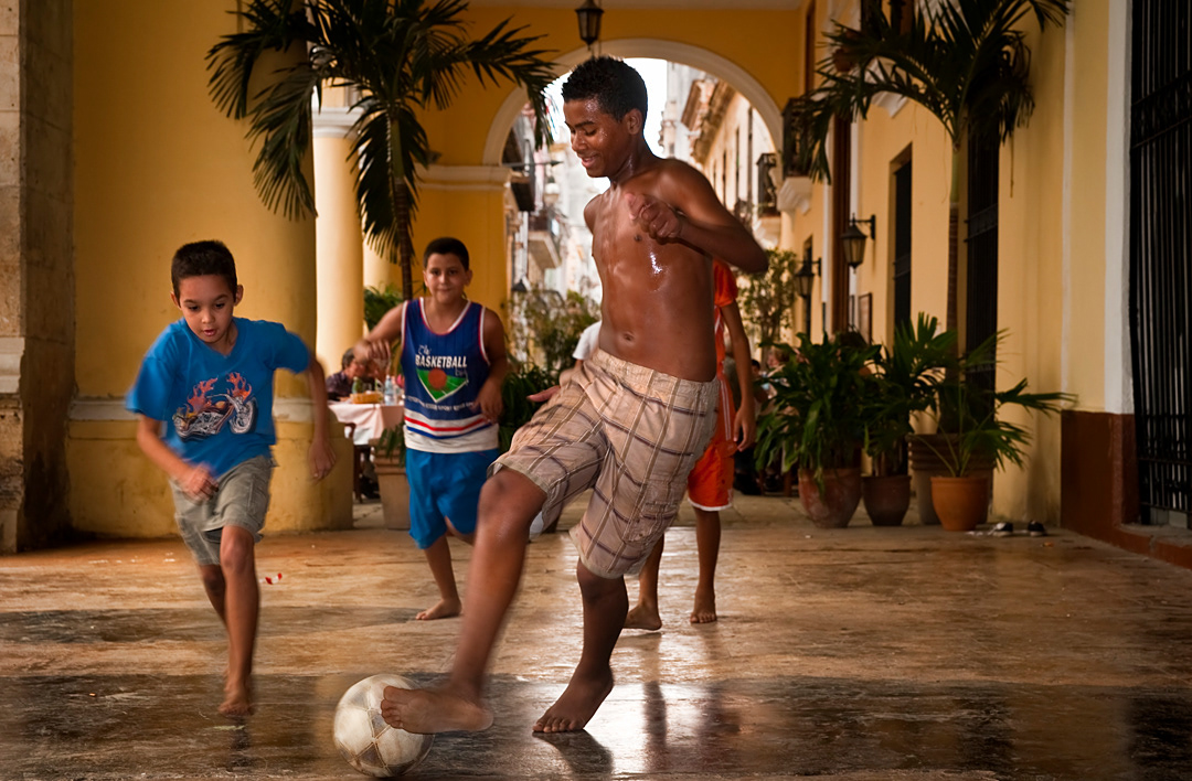 Children playing football in Plaza Vieja of La Habana. 