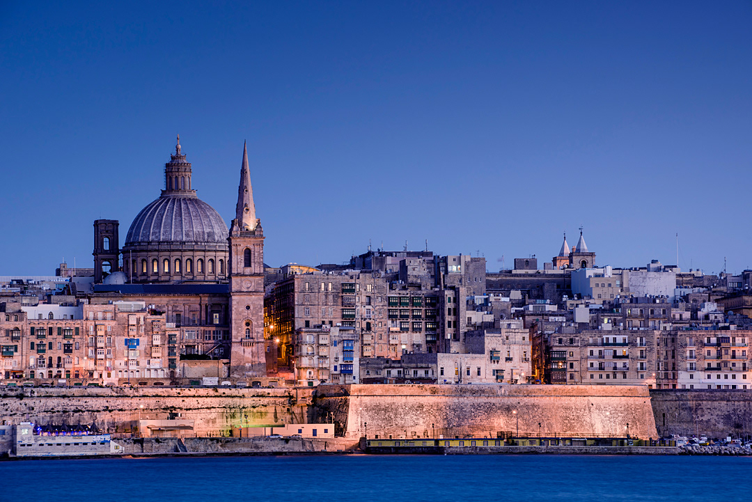 View of Valleta from Sliema with the dome of Our Lady Of Mount Carmel Church and the bell-tower of St Paul's Cathedral. 