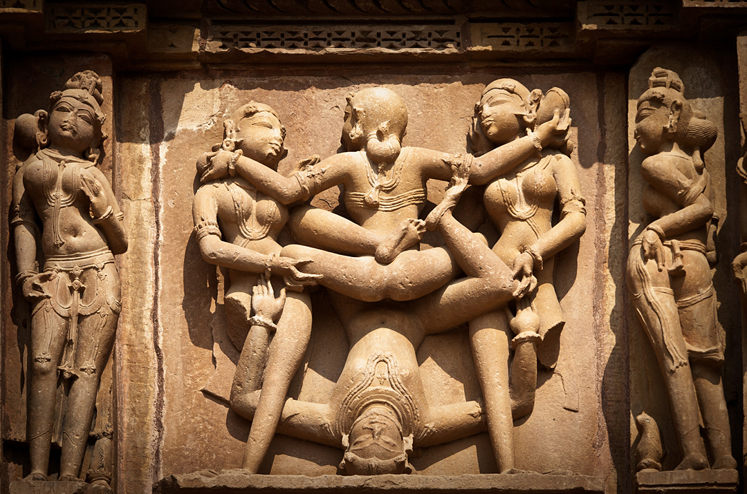 Erotic sculptures in a Khajuraho's temple. 
