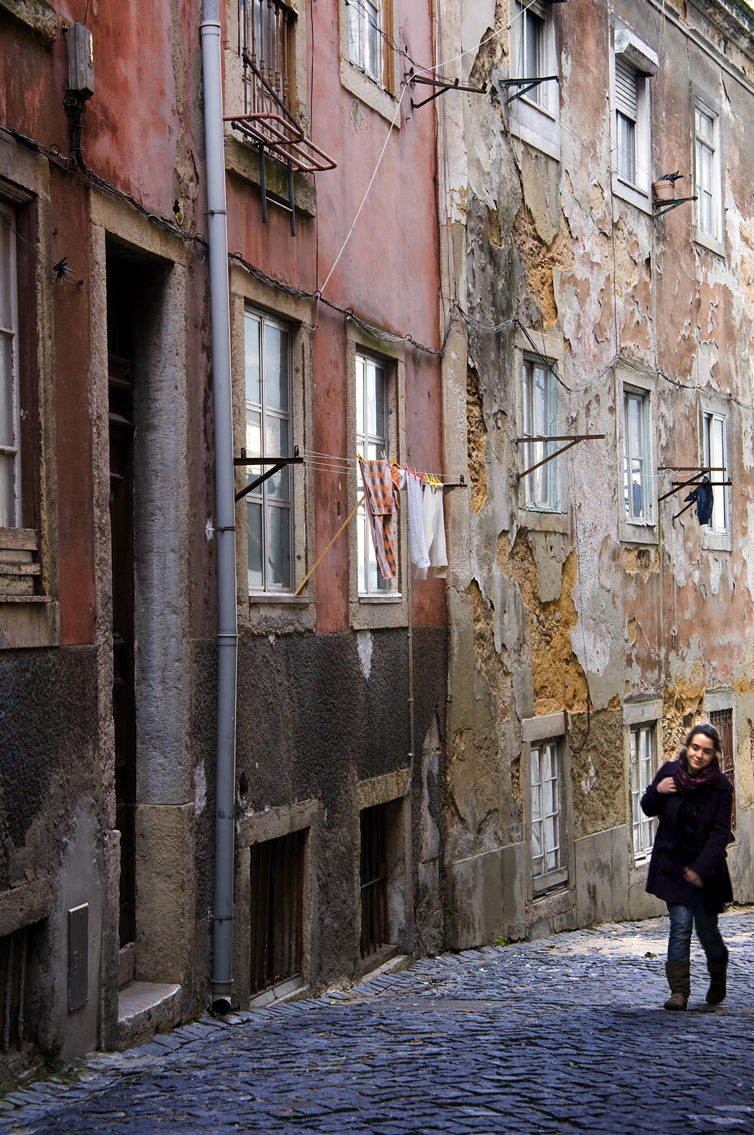 A girl in the old streets of the Alfama in Lisbon. 