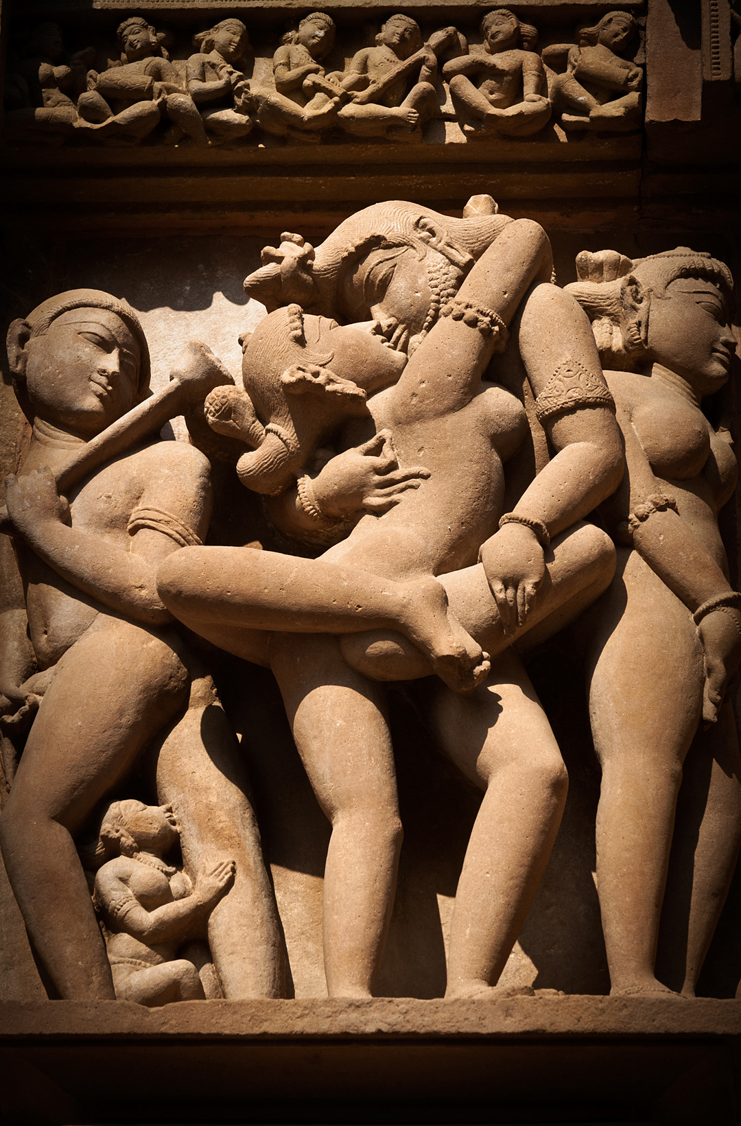 Erotic sculptures in a Khajuraho's temple. 